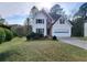 Charming two-story home with attached garage and well-manicured front lawn at 1535 Wilkes Crest Dr, Dacula, GA 30019