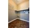 Utility room offering ample storage space with shelves and durable tile flooring at 1535 Wilkes Crest Dr, Dacula, GA 30019