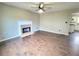 Inviting living room featuring a classic fireplace and hardwood floors at 1535 Wilkes Crest Dr, Dacula, GA 30019
