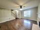 Spacious living room with hardwood floors, a fireplace, and staircase at 1535 Wilkes Crest Dr, Dacula, GA 30019