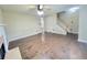 Open-concept living room with hardwood floors, fireplace, and staircase to the second level at 1535 Wilkes Crest Dr, Dacula, GA 30019