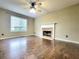 Bright living room boasts hardwood floors, a fireplace, and plenty of natural light at 1535 Wilkes Crest Dr, Dacula, GA 30019