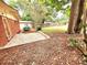 Brick patio surrounded by lush greenery and mature trees at 2089 Lenox Rd, Atlanta, GA 30324