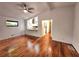 Open-concept living room showcasing hardwood floors and a kitchen view through a granite countertop pass-through at 2089 Lenox Rd, Atlanta, GA 30324