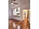 Open living space showcasing hardwood floors and a view to the modern kitchen at 2089 Lenox Rd, Atlanta, GA 30324