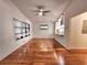 Bright living room with hardwood floors offers a view of the modern kitchen through a granite countertop pass-through at 2089 Lenox Rd, Atlanta, GA 30324