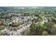 An aerial view captures a peaceful neighborhood with tree-lined streets and well-maintained homes at 2172 Misty Brook Ct, Buford, GA 30519
