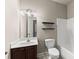 Bathroom with vanity, mirror, decorative shelves and tub with shower at 2172 Misty Brook Ct, Buford, GA 30519