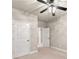 Bedroom with ceiling fan, carpet and 2 closets and doorway to hall at 2172 Misty Brook Ct, Buford, GA 30519