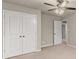 Neutral bedroom featuring large closet with overhead lighting and carpet at 2172 Misty Brook Ct, Buford, GA 30519