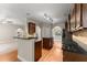 Open-concept kitchen with granite countertops, a center island, and stainless steel appliances at 2172 Misty Brook Ct, Buford, GA 30519