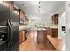 Spacious kitchen with stainless steel appliances, an island, and wooden cabinetry at 2172 Misty Brook Ct, Buford, GA 30519