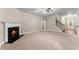 Spacious living room with fireplace, neutral carpet, and staircase at 2172 Misty Brook Ct, Buford, GA 30519