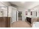En-suite bathroom with double doors, walk-in shower, and a soaking tub at 2172 Misty Brook Ct, Buford, GA 30519