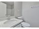 Bathroom with modern vanity, sink, toilet and shower/bath combo at 5570 Downs Way, Lithonia, GA 30058