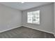 Comfortable bedroom with neutral paint, carpeting, and a window view at 5570 Downs Way, Lithonia, GA 30058