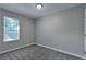 Comfortable bedroom with neutral paint, carpeting, and a window view at 5570 Downs Way, Lithonia, GA 30058