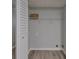 Bright laundry room with washer/dryer hookups and white shelving at 5570 Downs Way, Lithonia, GA 30058