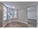Inviting living room features large windows and views of the front yard at 5570 Downs Way, Lithonia, GA 30058