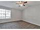 This is a main bedroom with natural light and ceiling fan at 5570 Downs Way, Lithonia, GA 30058