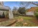 Spacious backyard with stone walkway, wooden fence, and a grassy lawn at 791 Woodland Se Ave, Atlanta, GA 30316