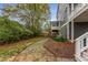 Backyard featuring stone pathway, mulched area, and a tiered deck at 791 Woodland Se Ave, Atlanta, GA 30316