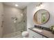 Modern bathroom features a glass shower, tiled walls, and granite countertop vanity at 791 Woodland Se Ave, Atlanta, GA 30316