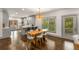 Dining room featuring hardwood floors, modern lighting, and access to an open kitchen at 791 Woodland Se Ave, Atlanta, GA 30316