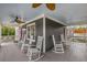 Inviting porch with ample seating, ceiling fans, and gray flooring at 791 Woodland Se Ave, Atlanta, GA 30316