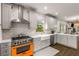 Bright kitchen featuring stainless appliances, white cabinetry, and modern backsplash at 791 Woodland Se Ave, Atlanta, GA 30316