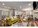 Open-concept living area with hardwood floors, modern decor, and access to kitchen at 791 Woodland Se Ave, Atlanta, GA 30316