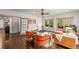 Cozy living room with hardwood floors, a leather sofa, and two accent chairs at 791 Woodland Se Ave, Atlanta, GA 30316