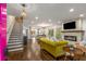 Spacious living room featuring hardwood floors, stylish fireplace and staircase at 791 Woodland Se Ave, Atlanta, GA 30316