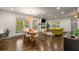 Spacious living room featuring a fireplace, hardwood floors and open layout to dining area and kitchen at 791 Woodland Se Ave, Atlanta, GA 30316
