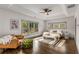 Bright main bedroom features a tray ceiling, hardwood floors, and plenty of natural light at 791 Woodland Se Ave, Atlanta, GA 30316