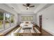 Light and airy bedroom featuring large windows, tray ceilings and hardwood floors at 791 Woodland Se Ave, Atlanta, GA 30316