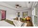 The main bedroom features a tray ceiling, hardwood floors, and a cozy seating area at 791 Woodland Se Ave, Atlanta, GA 30316