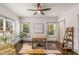 Comfortable office features large windows, wood floors, built-in shelving, and neutral decor at 791 Woodland Se Ave, Atlanta, GA 30316