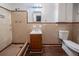 Tiled bathroom featuring a single sink vanity, toilet, and shower with tiled walls and floors at 1753 Thomas Ter, Decatur, GA 30032