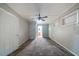Spacious bedroom featuring plush carpet, gray walls, a ceiling fan, and a window for natural light at 1753 Thomas Ter, Decatur, GA 30032