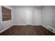 Bedroom featuring laminate flooring, neutral walls, and plenty of natural light at 1753 Thomas Ter, Decatur, GA 30032