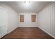 Bedroom featuring laminate flooring, neutral walls, and plenty of natural light at 1753 Thomas Ter, Decatur, GA 30032