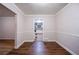 This dining room has new flooring, neutral walls, and an view into the kitchen at 1753 Thomas Ter, Decatur, GA 30032