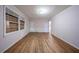 Living room with hardwood floors, pink walls, and a bright window, offering a cozy space at 1753 Thomas Ter, Decatur, GA 30032