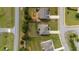Birds-eye view of well-maintained homes with green lawns and a quiet street, showing neighborhood layout at 312 Amble Side, Mcdonough, GA 30252