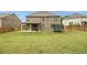 Spacious backyard with a well-maintained lawn and trampoline at 312 Amble Side, Mcdonough, GA 30252