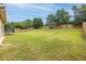 Large backyard featuring ample green space and a wooden fence at 312 Amble Side, Mcdonough, GA 30252