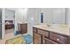Bathroom showcasing dual vanities and a peek of a themed bedroom at 312 Amble Side, Mcdonough, GA 30252
