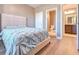Bedroom with wood-look floors and ensuite bathroom access at 312 Amble Side, Mcdonough, GA 30252