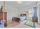 Comfortable bedroom with a cozy bed and carpeted floor at 312 Amble Side, Mcdonough, GA 30252